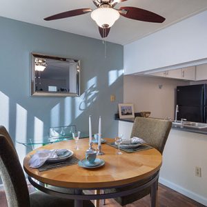 Model unit dining room and kitchen featuring modern finishes, and appliances